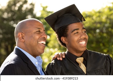 Proud African American Father Talking With His Son.