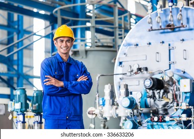 Proud Asian Worker Standing In Production Factory