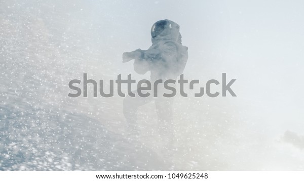Proud\
Astronaut Confidently Explores Alien Planet\'s Surface During the\
Blizzard. Cold Planet Covered in Gas and rock,  People Overcoming\
Difficulties, Important Moment for the Human\
Race.