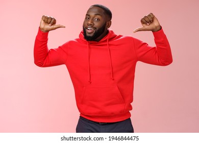 Proud confident arrogant good-looking african american bearded male coworker in red hoodie raise thumbs pointing himself bragging look cheeky talking accomplishments himself, standing pink wall - Shutterstock ID 1946844475