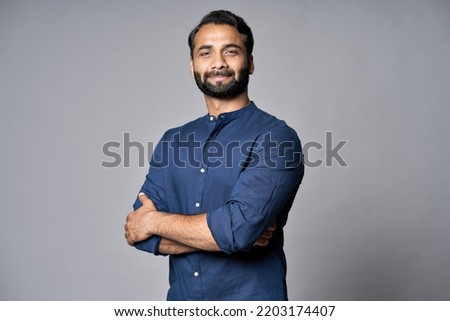 Proud confident bearded indian business man investor, rich ethnic ceo, corporate executive, professional lawyer banker, male office employee standing isolated on gray with arms crossed. Portrait