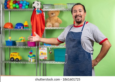 Proud Enterprising Man In His Toy Store Attending And Showing His Toy Store. Interior Detail