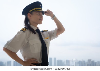 Proud Female Pilot At The Airport.