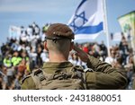 a proud israeli soldier with the flag