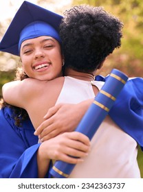 Proud Mother Celebrating And Hugging Teenage Daughter Wearing Graduation Robes Outdoors
