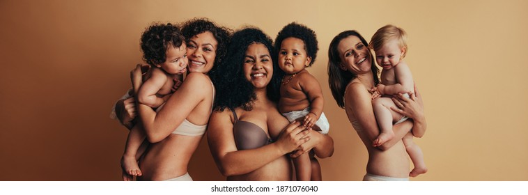 Proud Mothers With Postpartum Bodies Holding Their Babies. Three Women With Their Children.