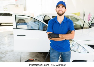 Proud Of My Work At The Car Wash. Portrait Of A Handsome Latin Young Man With A Cap And Blue Uniform Working At A Car Wash And Auto Detail Service