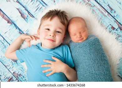 Proud New Big Brother And Newborn Baby Little Brother. Newborn And Sibling Portrait. 