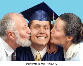 Proud parents kissing their graduating son on both cheeks
