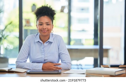 Proud And Relaxed Business Woman Or Financial Advisor Consultant With A Positive Mindset And Vision At The Office. Portrait Of A Young Accountant Smiling Ready For Work Sitting At Her Desk Smiling