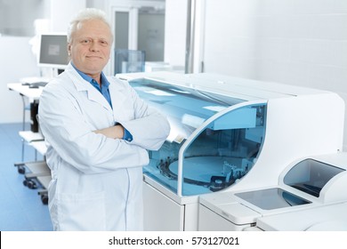 Proud Scientist. Elderly Scientist Smiling Posing Proudly At His Laboratory Near Modern Analyzing Machine Copyspace Research Biology Immunology Medical Industry Profession Experience Health Concept