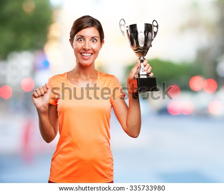 proud sport woman with sport cup