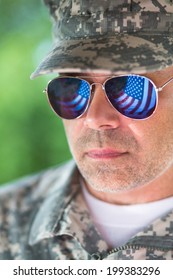 Proud Us Army Soldier With American Flag In Sunglasses Reflection