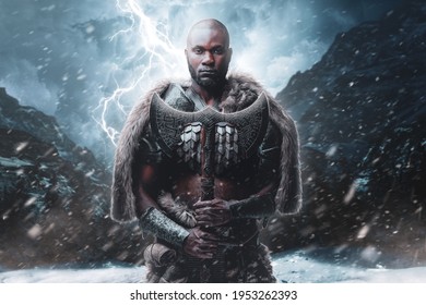 Proud viking with black skin holding his axe in stormy mountains