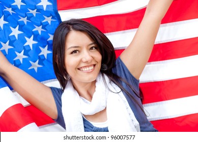 Proud Woman With The American Flag And Smiling