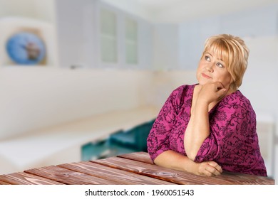 Proud Woman Posing In Her Kitchen Clean-smiling Mom Standing