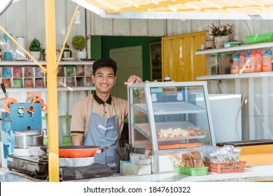 Proud Young Asian Man Small Business Owner At His Shop Made Of Truck Container Selling Street Food