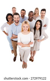 Proudly Successful. Top View Of Positive Diverse Group Of People In Smart Casual Wear Looking At Camera And Smiling While Standing Close To Each Other