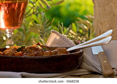 Provence Stew, Outdoors. Rose Wine. Olive Tree And Vineyard Background.