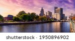 Providence, Rhode Island, United States. Panoramic view of a modern downtown city skyline on the Atlantic Ocean East Coast. Colorful Sunset Sky Art Render.