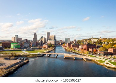 Providence, RI - October 21st, 2020: Pedestrians and tourists admire the city skyline from the modern new curved Providence River Pedestrian and Bicycle Bridge and terraced deck completed in 2019.