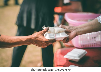 Providing free food for the poor hunger : concept of feeding, helping and sharing - Shutterstock ID 1752917579