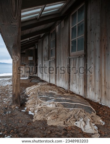 Provision cases; ghosts of Scott's, Discovery hut, Ross Island, Antarctica; The blubber stove; ghosts, of Scott's Discovery hut, Trousers hanging, to dry, never to be worn again; Under, the veranda;