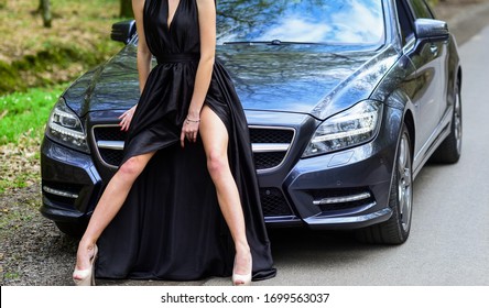 Provocative Concept. Luxury Car. Escort And Sexual Services. Seductive Pose. Sex In Car. Driver Girl. Beauty And Fashion. Woman In Black Dress Escort Service Worker. Sexy Girl Elegant Dress And Auto.