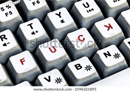 Provocative Keyboard Keys, Explicit Text on Worn-Out Keyboard. Close-Up of Grungy Keyboard with Controversial Lettering