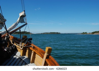 the prow of an old sailing ship navigating in the archipelago