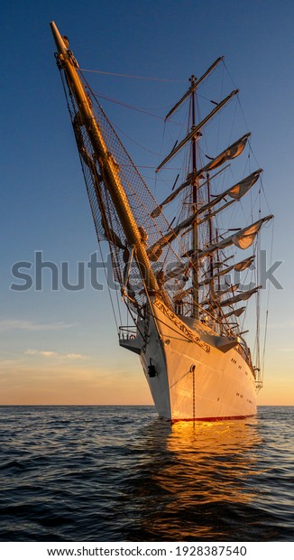 Prow of a sailing ship\
by day and at sunset, sea ocean water, sailing, white frigate, gift\
of the young