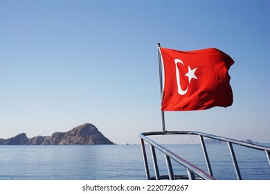 Prow Of The Yacht With The Turkish Flag In The Sea. Excursion On The Ship. In The Sea Near The Island Of Suluada.