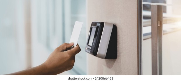 Proximity card door unlock, Hand security man using ID card on fingerprint scan reader access control system for identity verification to open the door or for security safety or check attendance.