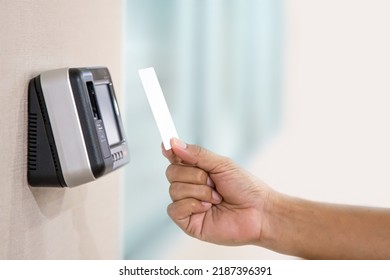 Proximity card reader door unlock, Hand security man using ID card on fingerprint scanning access control system for identity verification to open the door or for security safety or check attendance. - Shutterstock ID 2187396391