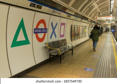 PS5 launch promotional event at Oxford Circus Underground Station. Victoria Line platform with Playstation logo above seating. London - 19th November 2020