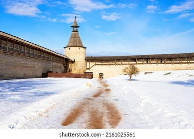 Pskov Kremlin, Russia. Part Of The Fortress Wall In Winter. White Snow And Blue Sky