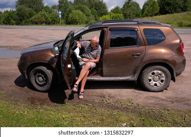 Pskov Region. Russia - July 5, 2018: Point Of Sale Of Green Car Cards And Insurance CTP On The Border With The Republic Of Belarus. Man Examines Insurance Documents.