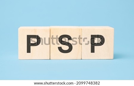 psp word written on wooden cubes with copy space