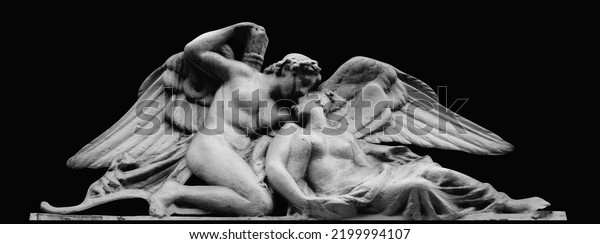 Psyche revived by Cupid\'s\
kiss. Isolated on black background. Black and white image.\
Horizontal image.