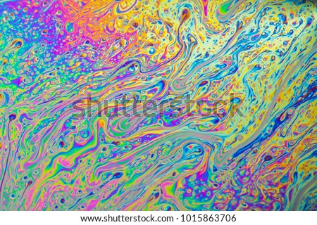 Psychedelic abstract formed by light interference on the surface of a soap bubble