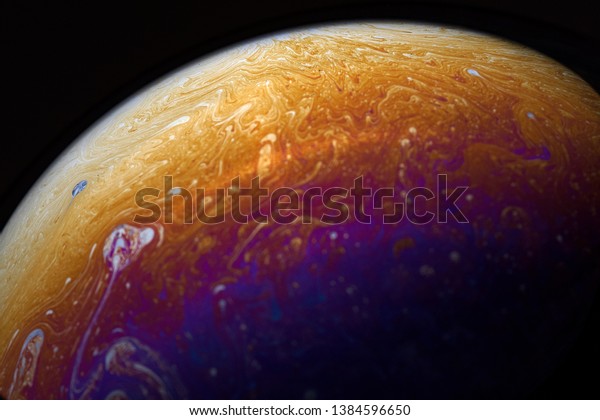 Psychedelic abstract\
planet-like soap bubble, light refraction on a soap bubble, colors\
in soap bubble.