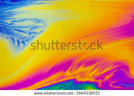 Psychedelic multicolored patterns background. Photo macro shot of soap bubbles