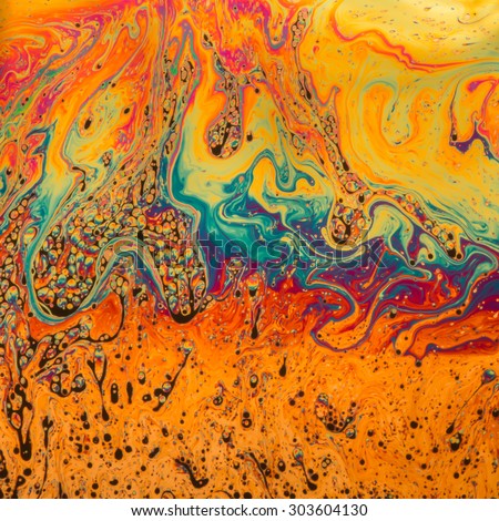 Psychedelic patterns formed on the surface of soap bubbles