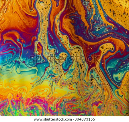 Psychedelic patterns formed on the surface of soap bubbles