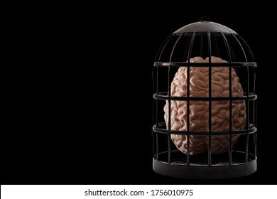 Psychiatry And Psychology, Helpless Mind And Hopeless Mental State, Consciousness And Depression Conceptual Idea With A Human Brain In A Dark Cage Isolated On Black Background With Copyspace