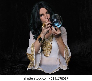 Psychic Fortune Teller With Crystal Ball On Black Background