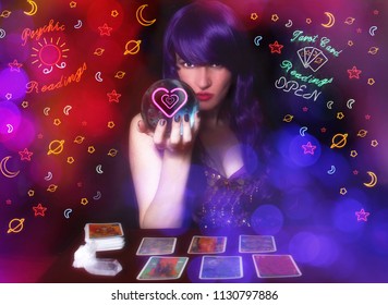 Psychic Tarot Card Reader With Purple Hair And Crystal Ball. Neon Lights In Background With Bokeh Effect