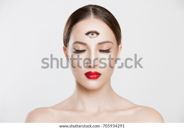 Psychic. Woman with 3 third eye looking at you\
camera concentrating thinking with mind and heart intuition about\
problem isolated white grey background. Making smart decision find\
solution concept