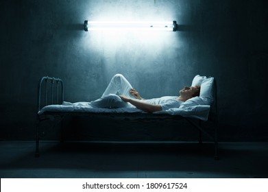 Psycho Man Lying In Bed, Dark Room On Background