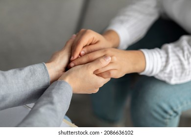 Psychological support. Psychotherapist offering help to young woman, holding her hands during psychotherapy session, closeup. Unrecognizable psychiatrist providing assistance to female patient - Shutterstock ID 2086636102